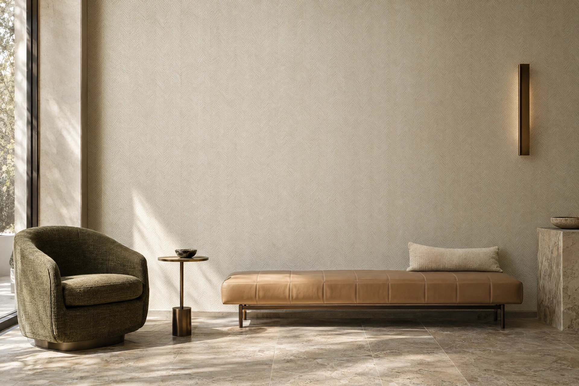Ivory textured wallcovering behind a caramel bench, olive chair and slim bronze table in a quiet sitting area.